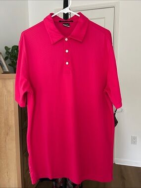 Tiger Woods Men’s Golf Polo. Size medium. Pink. PTP 22”. Excellent condition.